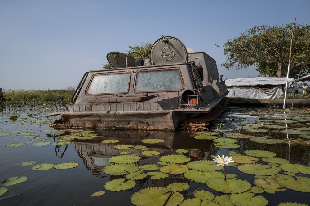 An armored vehicle submerged by flood waters in Mayendit, Unity State, South Sudan, November 23, 2022.South Sudan, the world's youngest country plagued by politic-ethnic violence and chronic instability since its independence from Sudan in 2011, is experiencing massive floods for the fourth consecutive year, reaching 2022 its highest level of destruction. Unprecedented floods have submerged large swathes of the country and displaced hundreds of thousands of people. According to UNHCR nearly one million people have been directly impacted by water and forced to flee their homes in search of food and shelter. In the area, the water level rose between one and two meters high, devastating everything in its path: infrastructure, homes, offices, hospitals, bridges, and roads disappeared underwater.