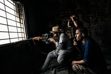 A Misurata's sniper, loyal to Libya's Government of National Accord, fires his weapon during clashes against the Islamic State positions in District 3 in Sirte on September 21, 2016.