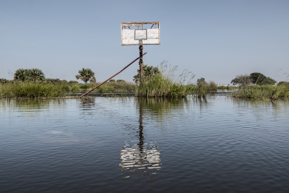 A basketball court submerged by floodwaters in Mayendit, Unity state, South Sudan, November 22, 2022. In the area, the water level rose between one and two meters high, devastating everything in its path. Infrastructure, homes, offices, hospitals, bridges, and roads disappeared underwater.
