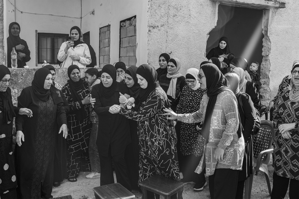 Women, relatives and friends of Majdi Awad, 67 years old, mourn his death in the family home in Tulkarem on November 1, 2023. Majdi Awad was killed during an IDF nighttime raid in Tulkarem. Majdi, a civilian, was killed early in the morning as he was heading to the mosque for prayers.