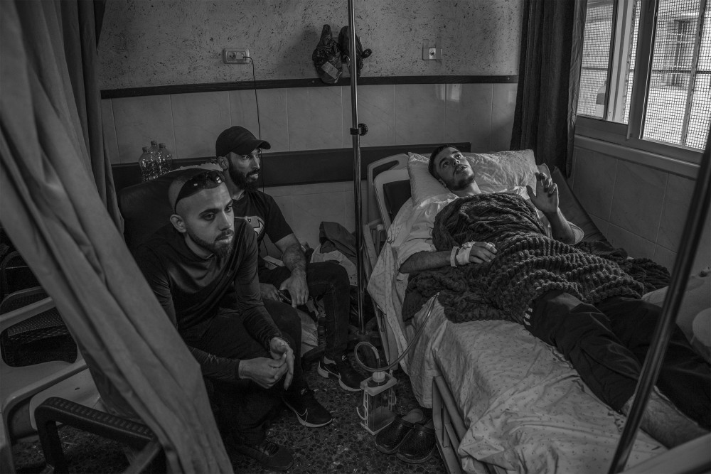 Abu al Abed, 21 years old (nickname), lies in his hospital bed in Nablus after being injured by an IDF drone in the Jenin refugee camp, which resulted in 4 deaths and 24 injuries, October 29, 2023.