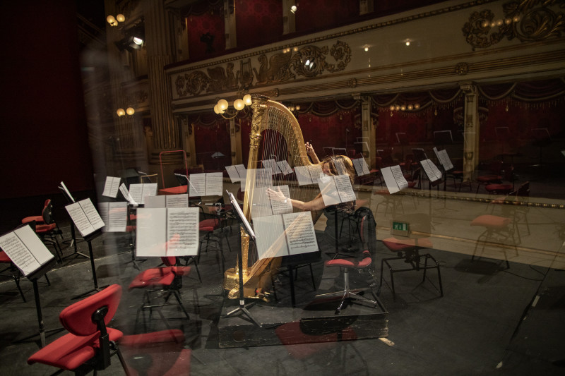A musician practices playing the harp before the concert at La Scala Theater of Milan on March 24, 2021. The classical music concert, directed by the Director Nicola Luisotti will be broadcast only in streaming. Due to Covid-19 precautionary measures, spectators are not admitted to the theater. In March 2020, Italy found itself at the center of the global epidemic of Covid-19. Today, a year later, the country is facing a new peak of growth (the third wave) of infections and victims. The government responded by imposing a new lockdown in the various regions and closing one more time any artistic and cultural activity: one of the most affected sector by the economic crisis today.